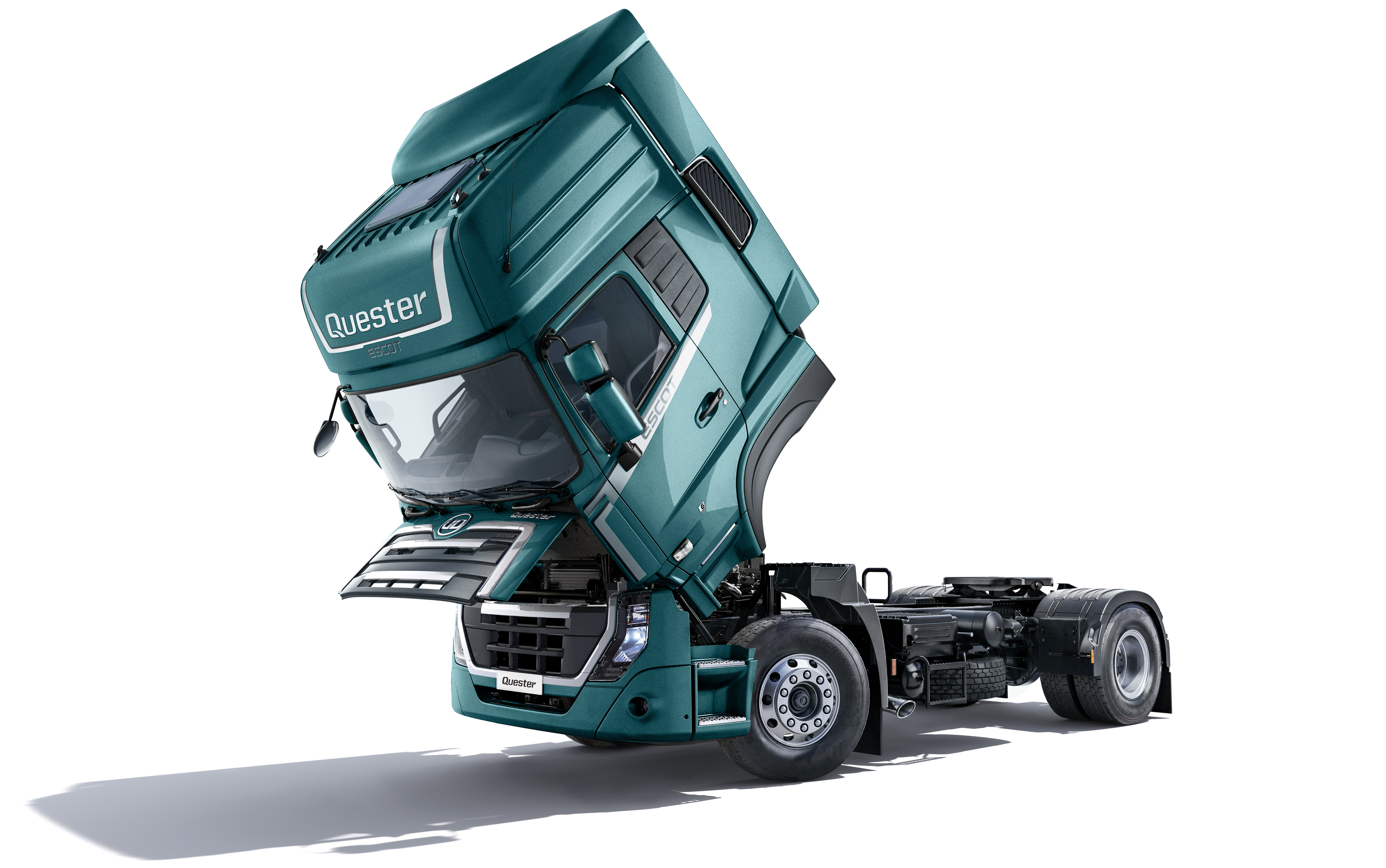 Green semi truck with tilted cab on white background.