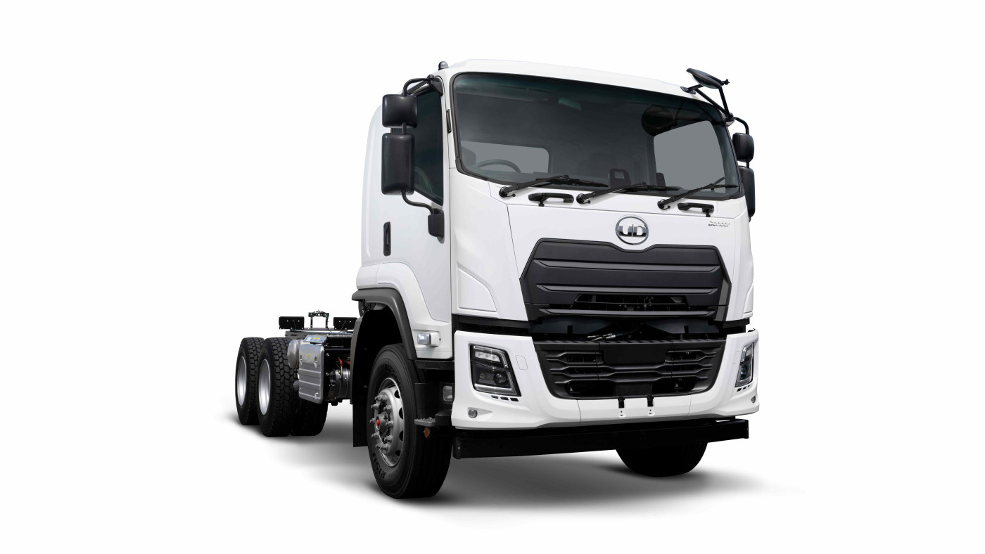 White commercial truck cab with black grille on plain background.