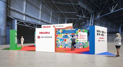 Colorful exhibition booth with people standing, featuring ISUZU and Thai signage.